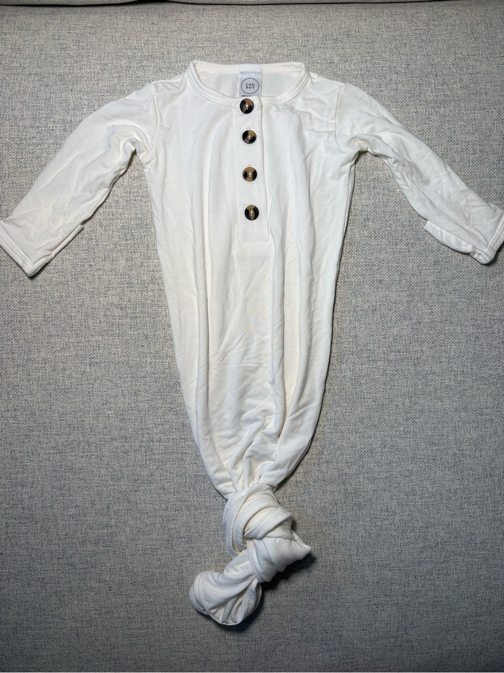 Lou Lou & Company Ivory Knotted Baby One-Piece with Button Placket
